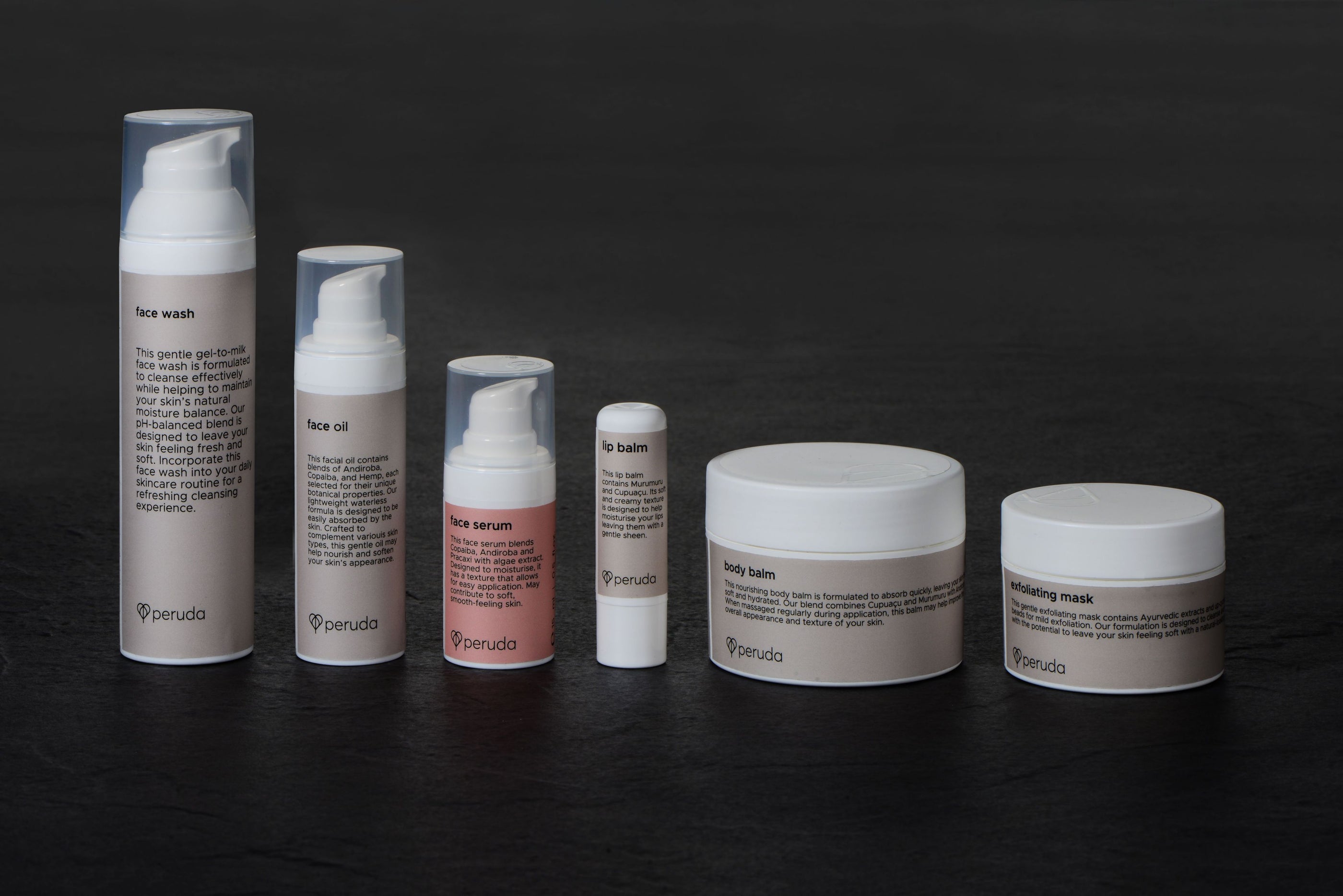 Skincare products including a face wash, face oil, face serum, lip balm, body balm and an exfoliating mask.