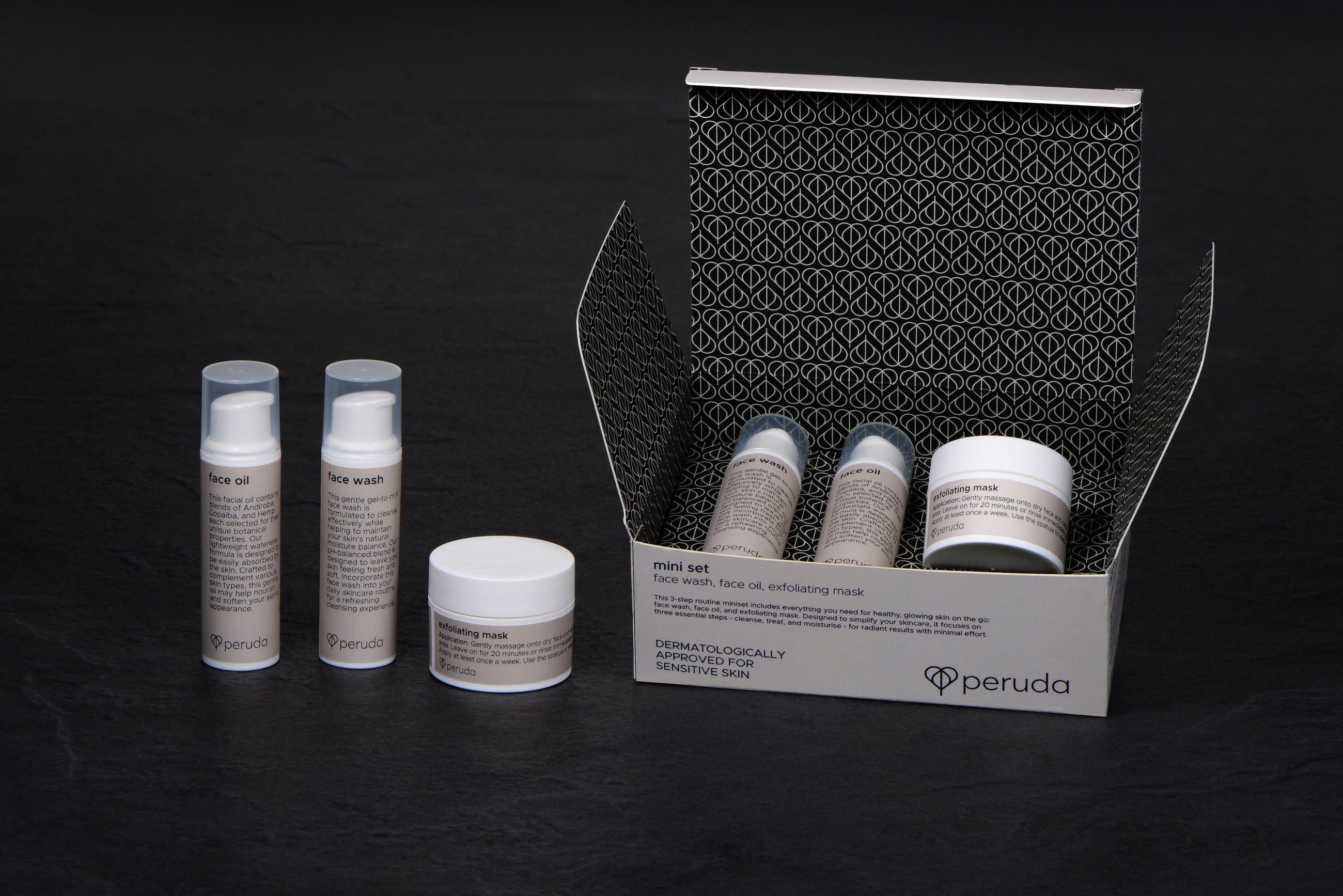 A Peruda mini set next to a face oil, face wash and exfoliating mask.