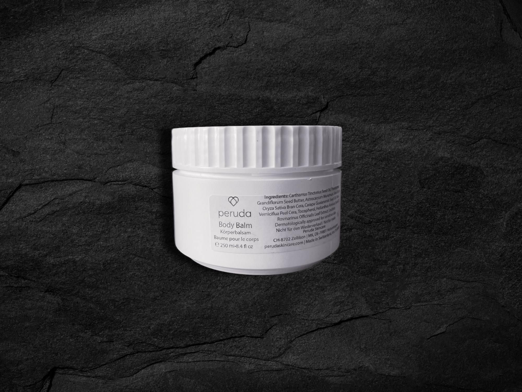 A white 250ml jar of Peruda body balm.