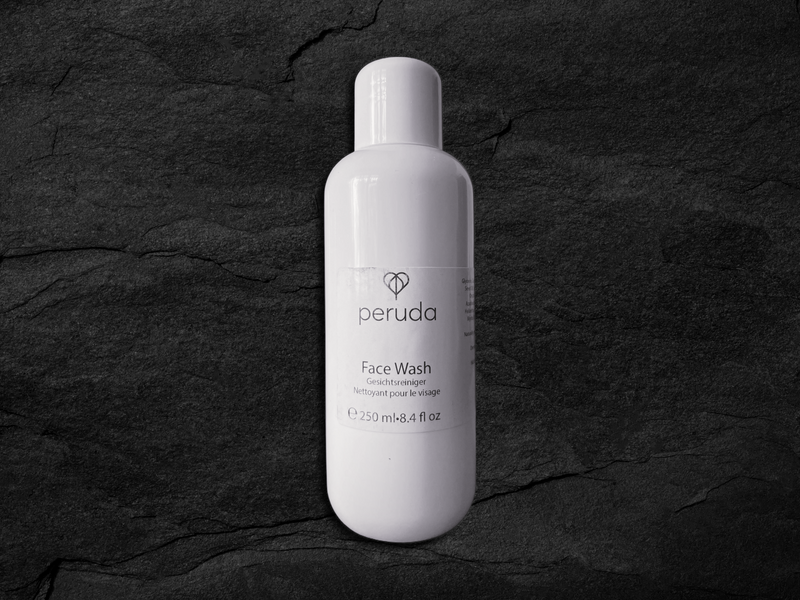 A white 250ml bottle of Peruda Face Wash.