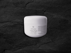 A white jar of Peruda 'Peeling-Maske' exfoliating mask.
