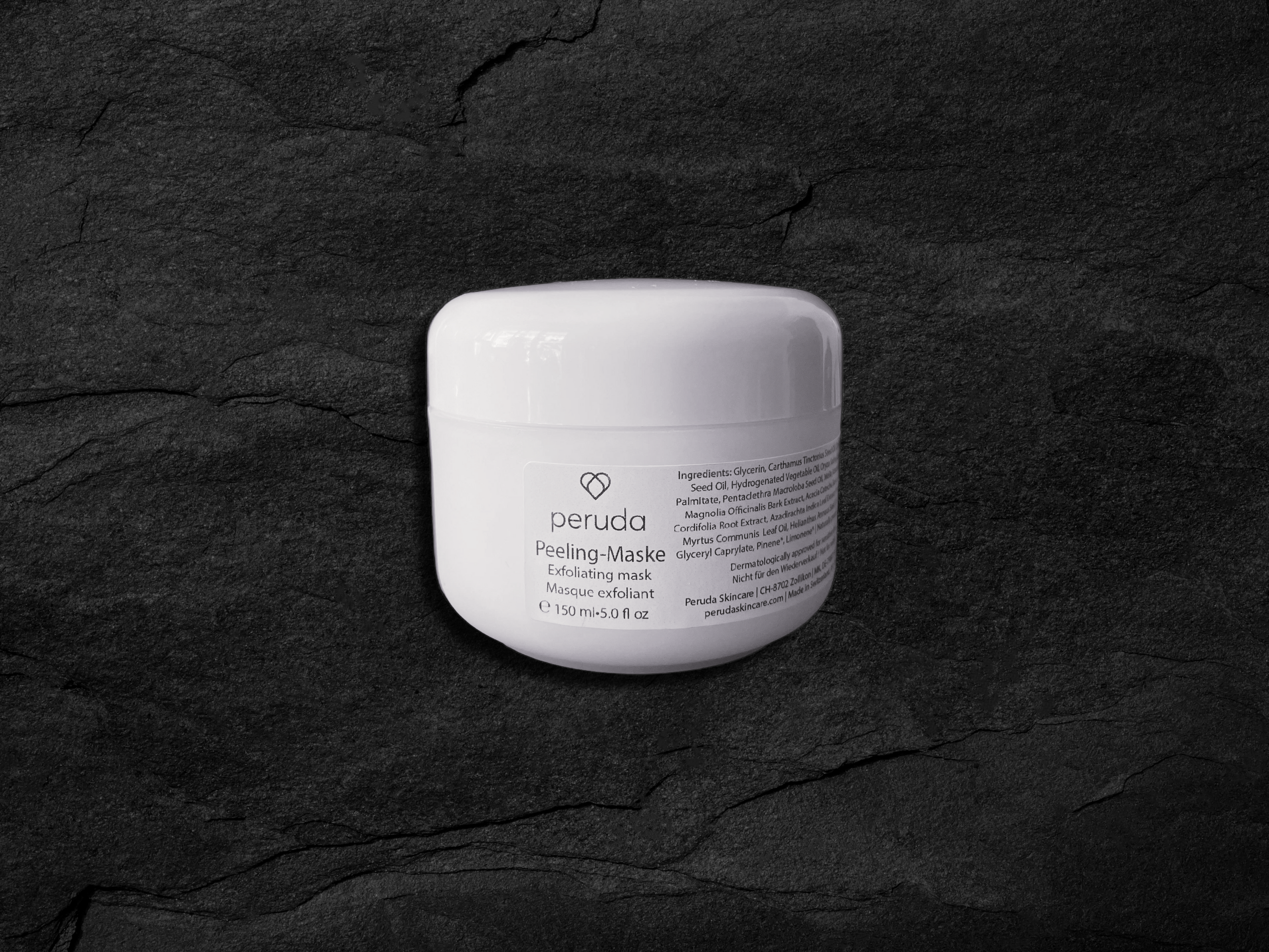 A white jar of Peruda 'Peeling-Maske' exfoliating mask.
