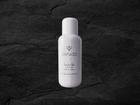 A white 100ml bottle of Peruda Face Oil.