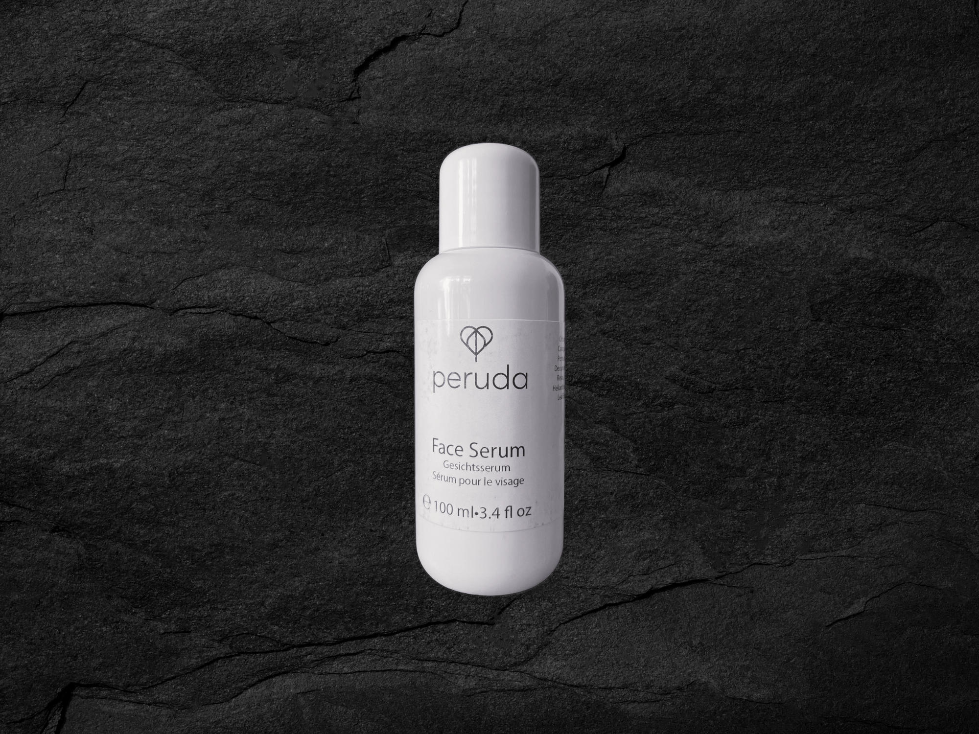 A 100ml white bottle of Peruda Face Serum.