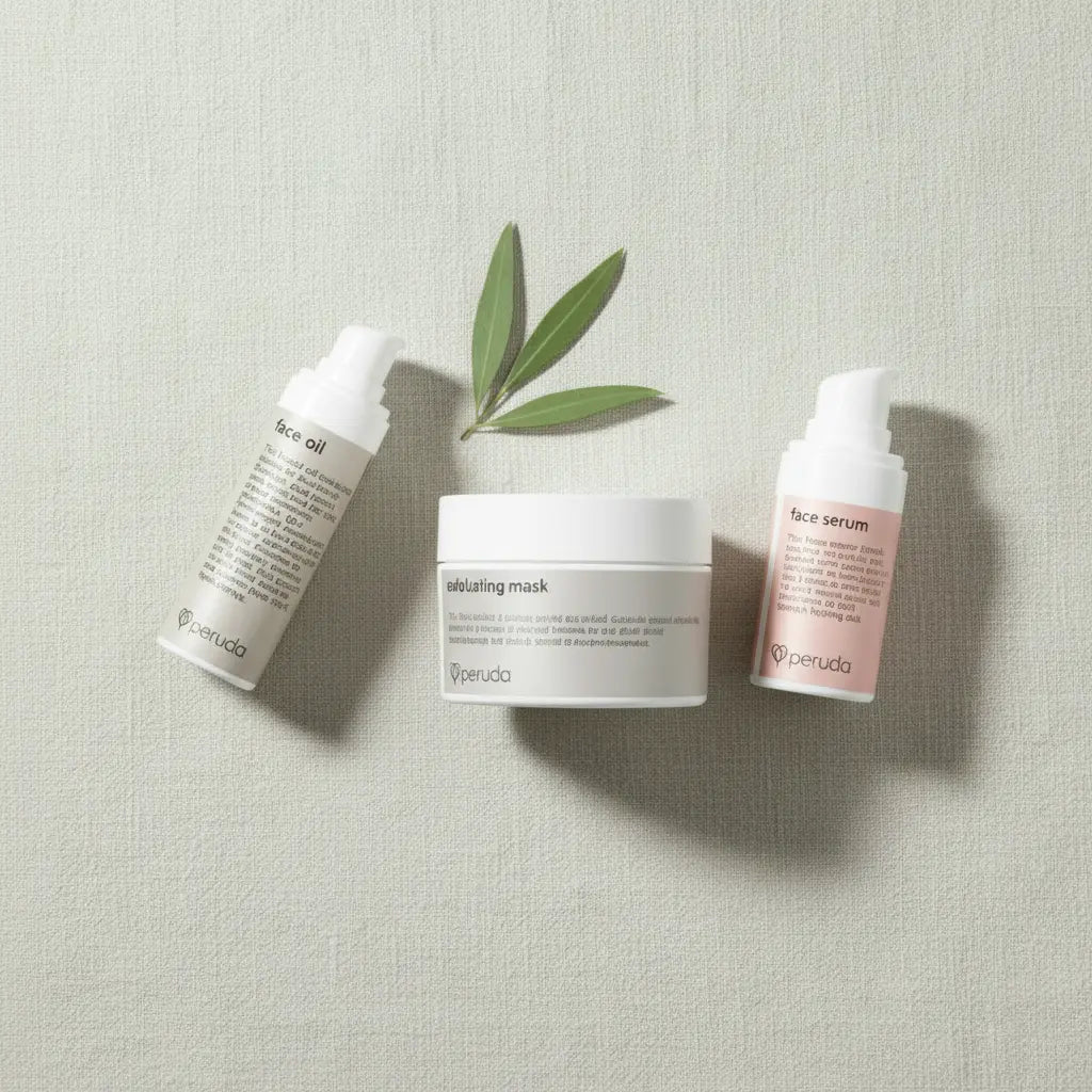 Three Peruda skincare products arranged on a textured light beige surface: a face oil bottle, a healing mask jar, and a face serum bottle, with a green leaf sprig between them.