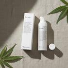 peruda skincare face wash bottle and box on linen fabric with green leaves