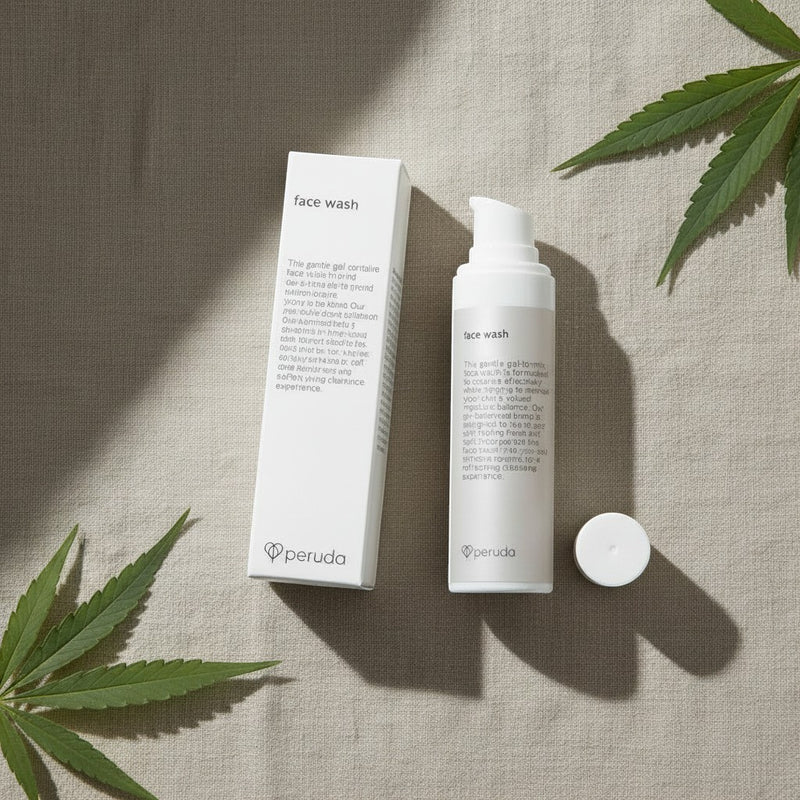 peruda skincare face wash bottle and box on linen fabric with green leaves