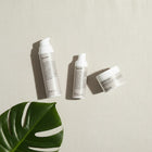 peruda skincare three-step sensitive skin ritual set with face wash, face oil, and exfoliating mask on linen